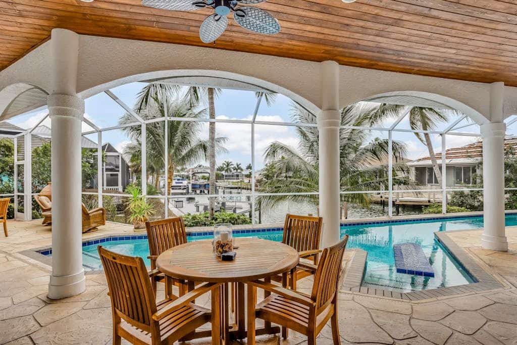 Luxury canal home with pool, alfresco dining, & walk-in shower - walk to beach