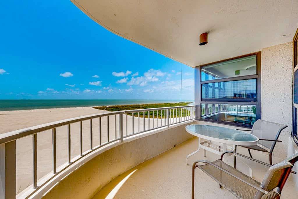 Gulf-front getaway with on-site pool, tennis, putting green, dock, & gym