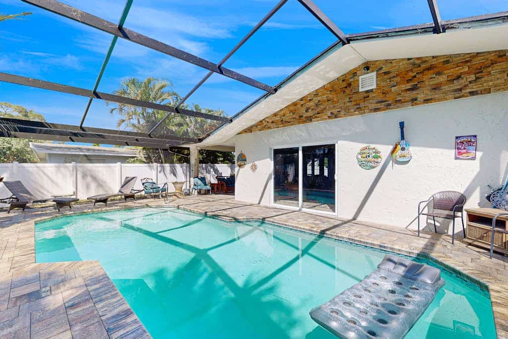 NEWLY RENOVATED:Luxurious Living and Open Concept W/ Pool on your Naples Retreat