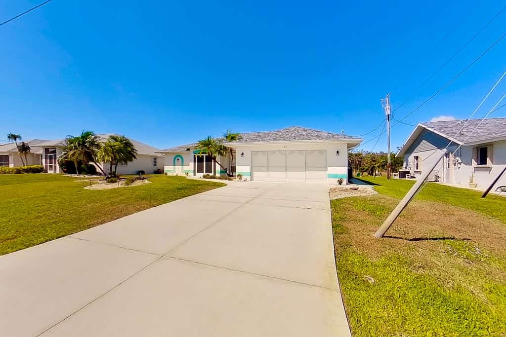 Bohemian canal-front retreat with pool, beach gear, adult bikes, & AC - dogs ok