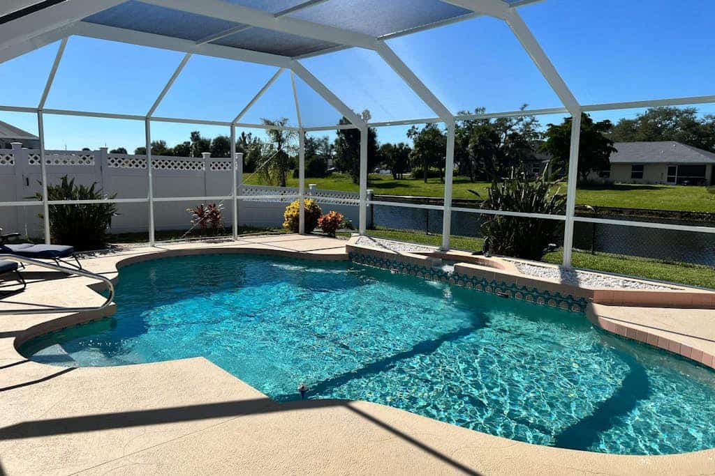 Bohemian canal-front retreat with pool, beach gear, adult bikes, & AC - dogs ok