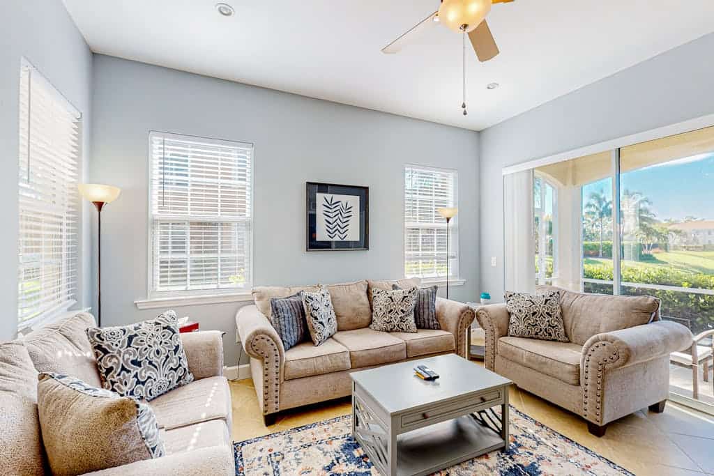 Water-view condo with screened patio, pool, central AC, & private washer/dryer
