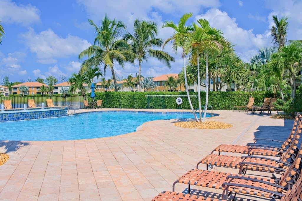 Water-view condo with screened patio, pool, central AC, & private washer/dryer