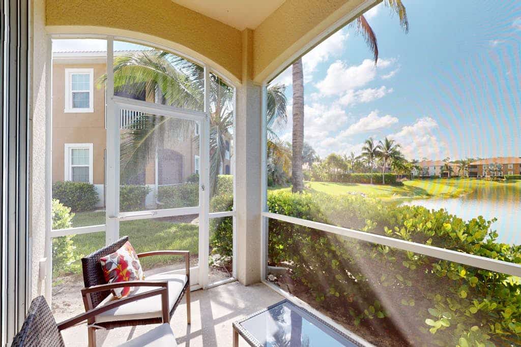 Water-view condo with screened patio, pool, central AC, & private washer/dryer