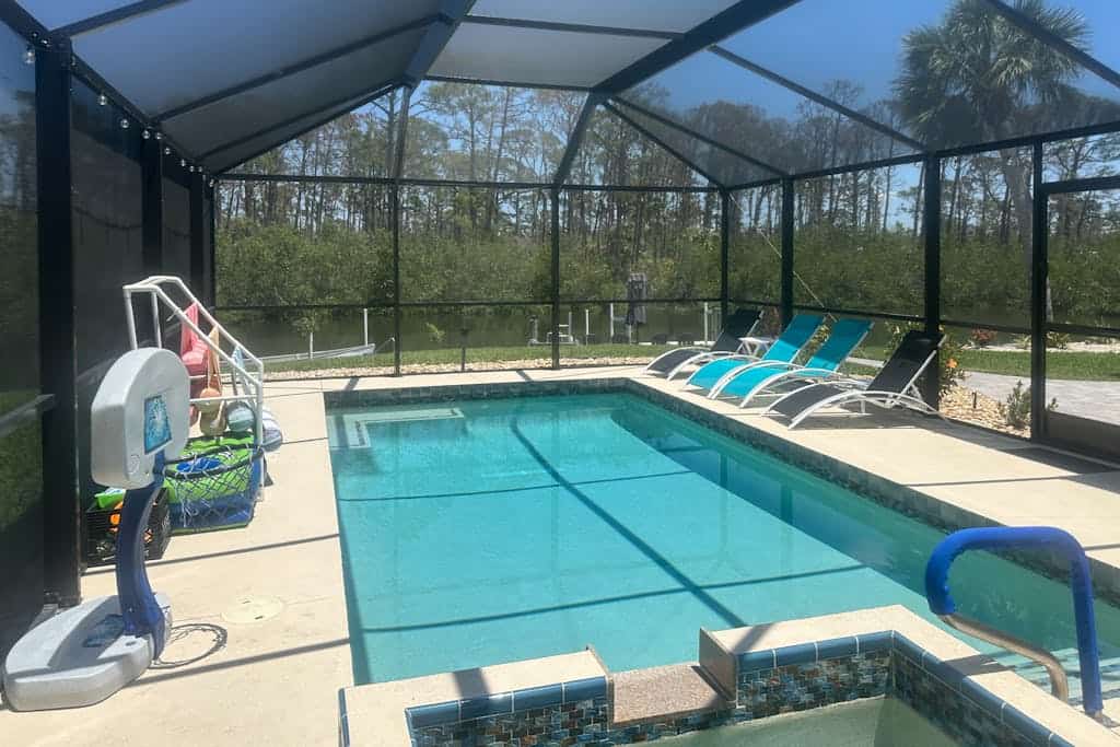 Outdoor paradise on waterway with pool and spa, beach gear, and dog friendly