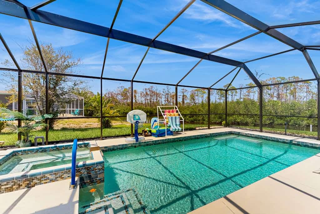 Outdoor paradise on waterway with pool and spa, beach gear, and dog friendly