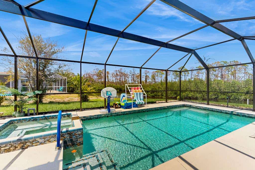 Outdoor paradise on waterway with pool and spa, beach gear, and dog friendly