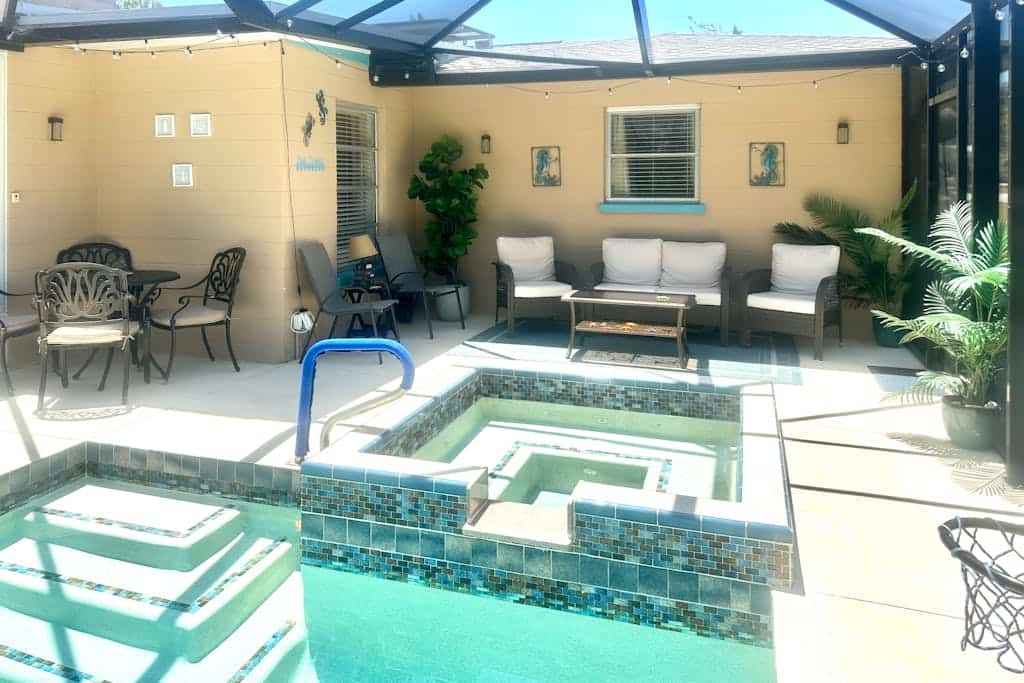 Outdoor paradise on waterway with pool and spa, beach gear, and dog friendly