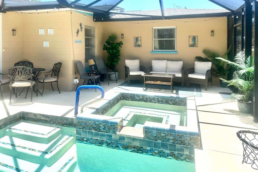 Outdoor paradise on waterway with pool and spa, beach gear, and dog friendly