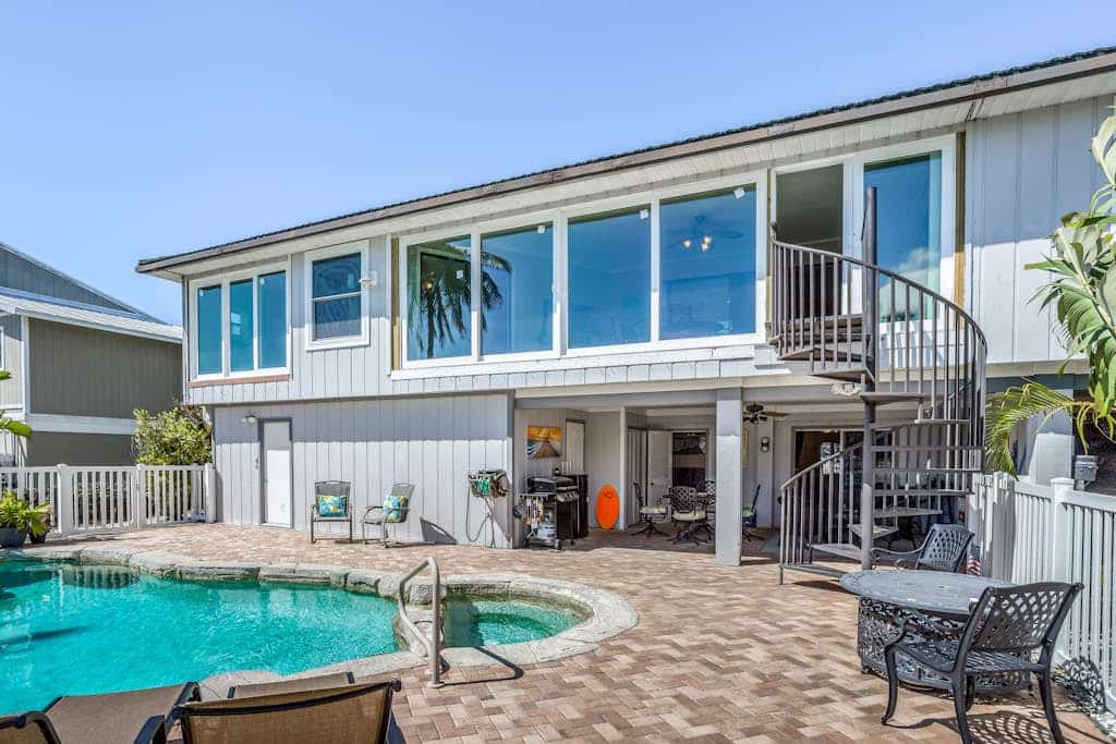 Canal-front home with private lagoon pool, dock,  AC, & W/D - dog-friendly