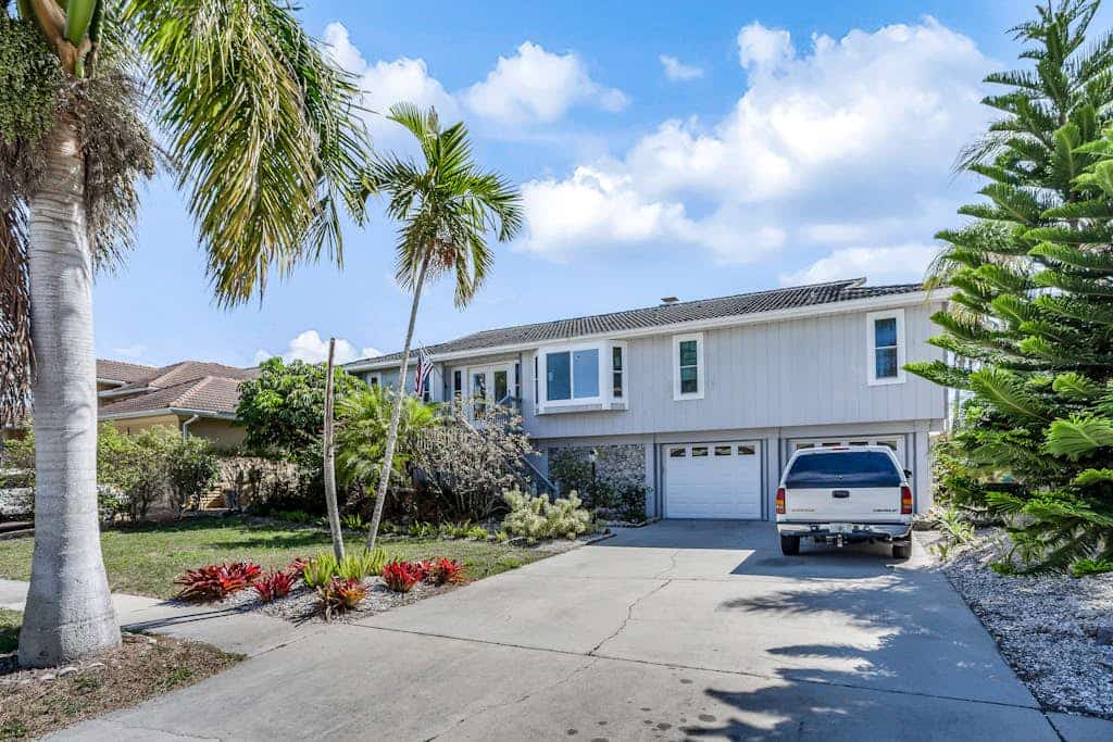 Canal-front home with private lagoon pool, dock,  AC, & W/D - dog-friendly