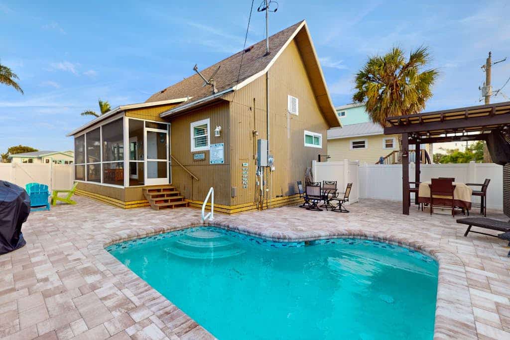 Bright & breezy beach house with private pool, sunroom, washer/dryer, & AC