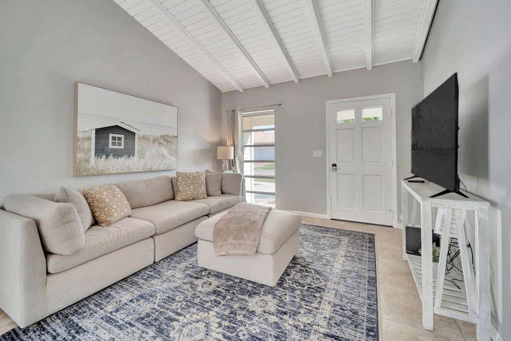 Updated tropical home with a private patio, beach gear, AC, and washer/dryer