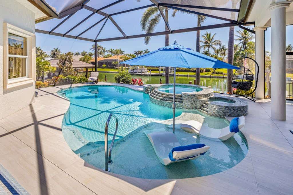 Luxe home near the water with private heated pool, pool spa, grill, firepit, AC