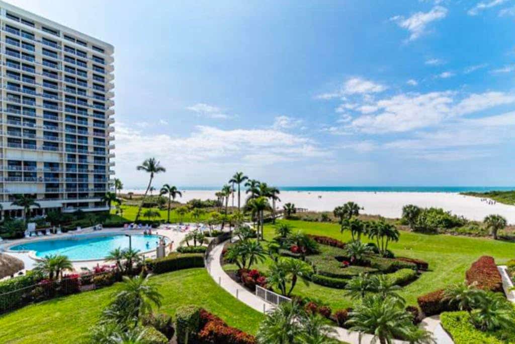 Waterfront, gulf view condo by beach with pool, dock & balcony