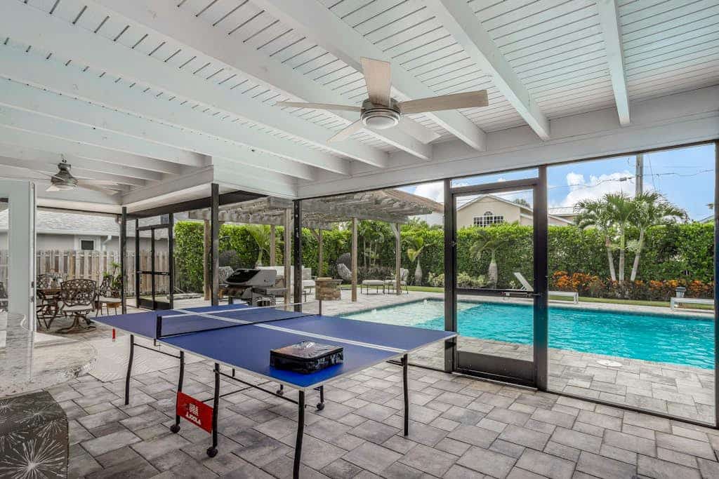 Inviting retreat with a large yard, heated pool, firepit, games & modern charm