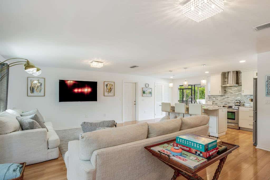 Inviting retreat with a large yard, heated pool, firepit, games & modern charm