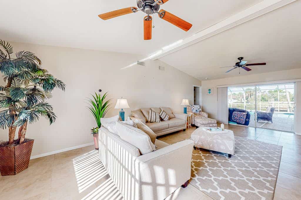 Waterfront home with an enclosed pool, outdoor kitchen, and grill - dog-friendly
