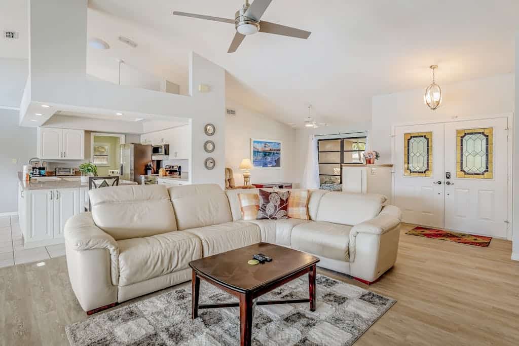 Canal-front home with sandy beaches, golf courses, dock, & refreshing pool