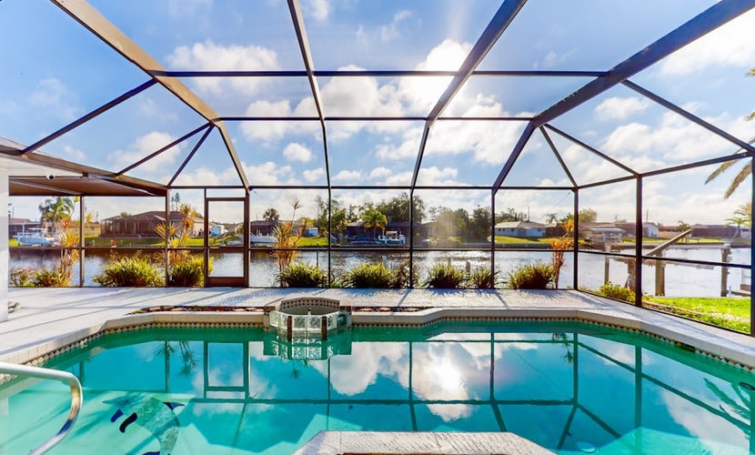 Snowbird Friendly Waterfront Escape with Private Pool, Dock & Serene Canal Views