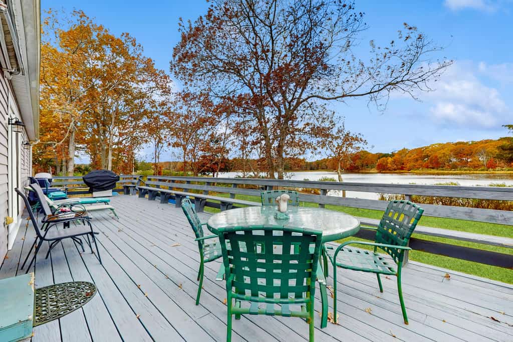 Waterfront Cape house with large deck, fireplace, modern kitchen & grassy yard