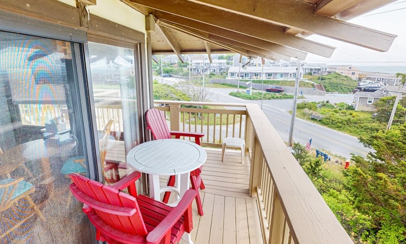 Cozy studio condo with bay views, deck, and beach steps away