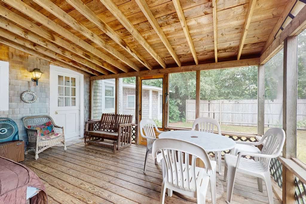 Inviting, two-story home with a large yard, sunroom, balcony, & washer/dryer