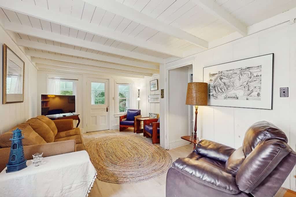 Inviting, two-story home with a large yard, sunroom, balcony, & washer/dryer