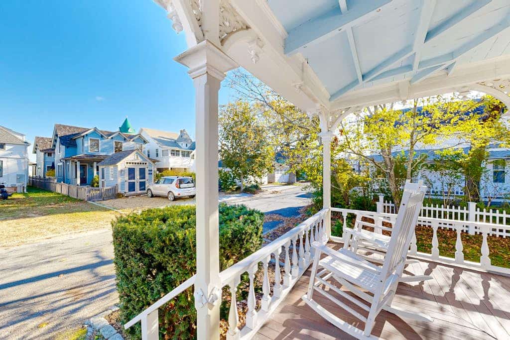 Historical house with wraparound porch, modern updates, enclosed yard, & W/D