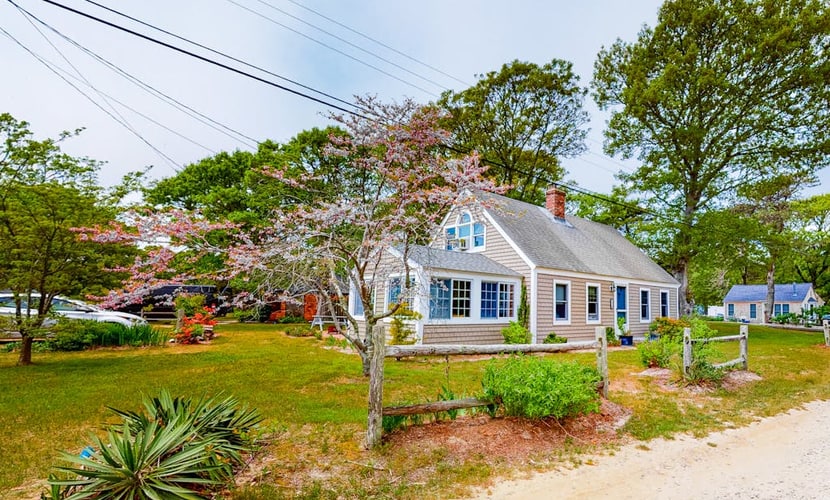Two-story home with beach access, sunroom, fast WiFi, washer/dryer, & partial AC