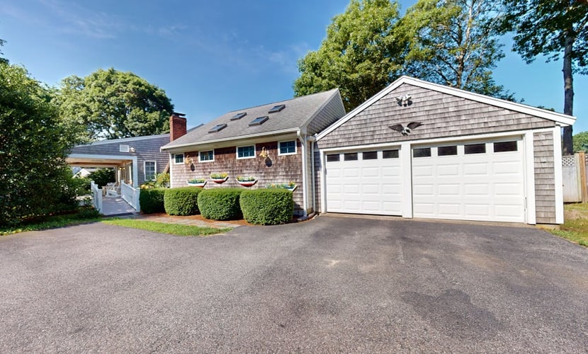 Tree-lined home with lovely yard, decks & private beach access - walk to town