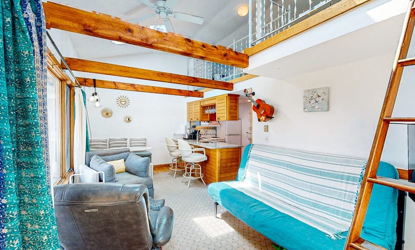 Seaside condo with patio, beach access, loft, board games, gas grill, & firepit