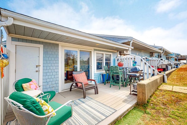 Seaside condo with patio, beach access, loft, board games, gas grill, & firepit