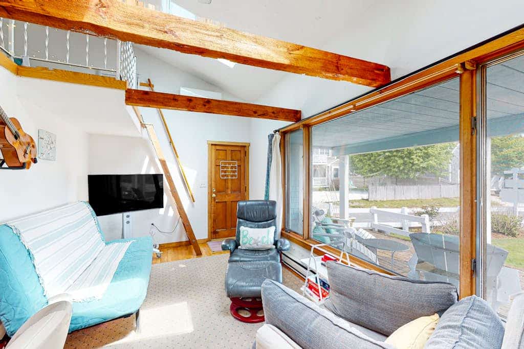 Seaside condo with patio, beach access, loft, board games, gas grill, & firepit