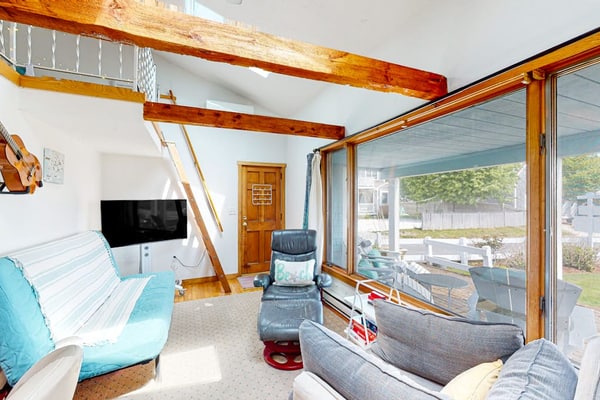 Seaside condo with patio, beach access, loft, board games, gas grill, & firepit