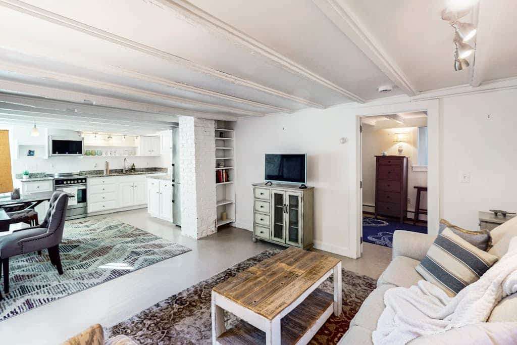 Modern & bright condo with patio, W/D, and central location near town & beach
