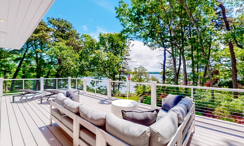 Luxe lakefront home on Follins Pond with private beach, amazing decks & yard