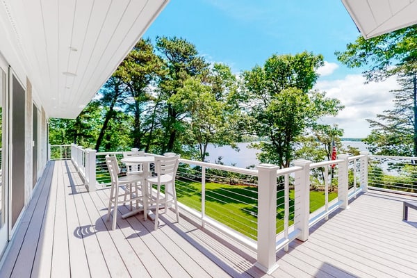 Luxe lakefront home on Follins Pond with private beach, amazing decks & yard