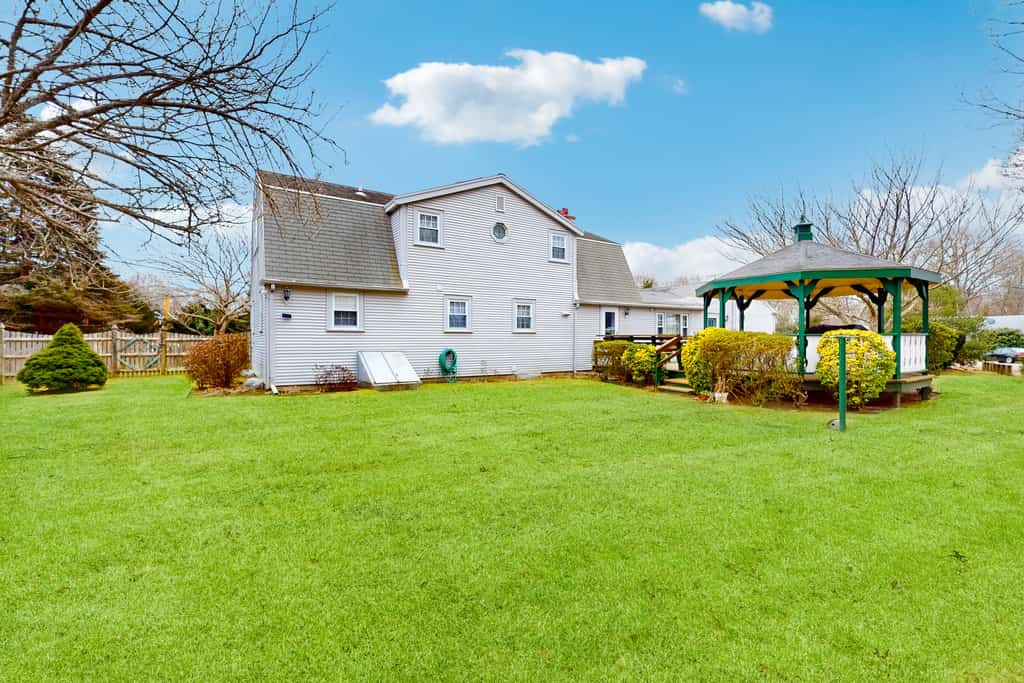 Traditional coastal home with large yard, gazebo, grill, smart TVs, washer/dryer