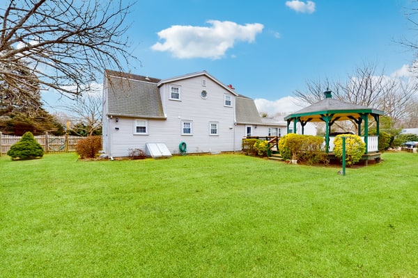 Traditional coastal home with large yard, gazebo, grill, smart TVs, washer/dryer