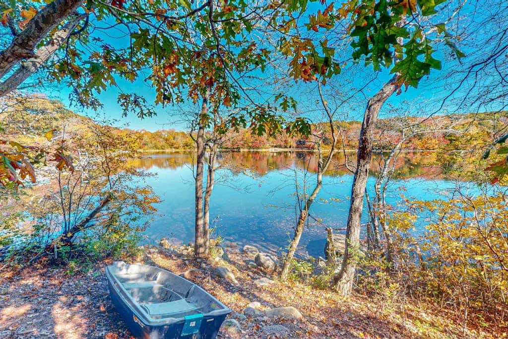 Sprawling dog-friendly lake estate with pool, patio, fire pit, games, & views