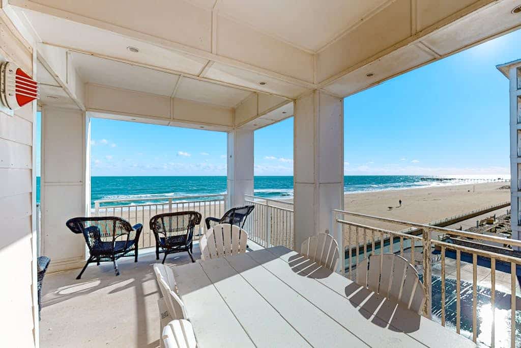 Beachfront 2nd-floor condo with ocean views, balcony, 3 pools & gym