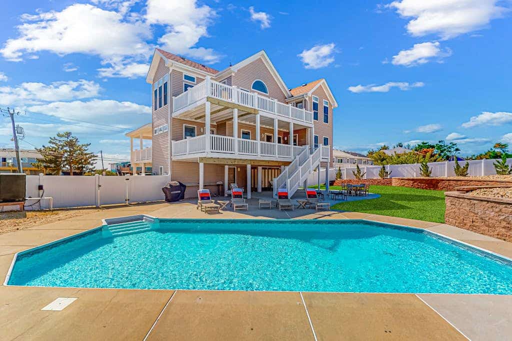 Three-story beach dream with a private pool, decks, & central AC