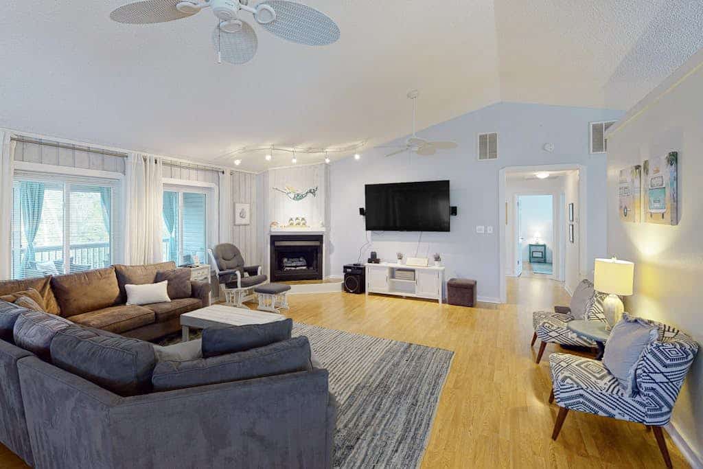 Lakefront home with water access, canoes & screened porch - walk to the beach
