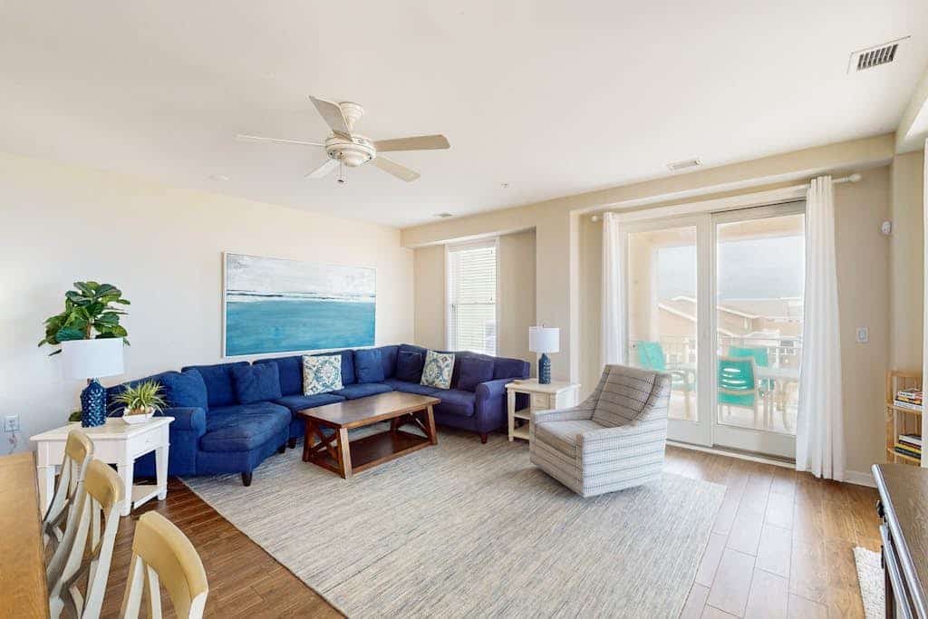Coastal-themed beachfront condo with water views, W/D, pool, gym & AC