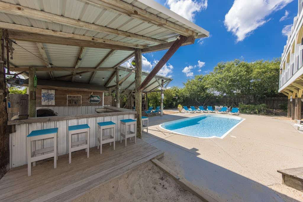 Renovated canal home with private pool, dock, roof deck, ocean/bay view, wet bar