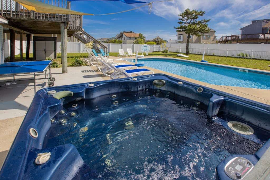 Oceanside beach house with private hot tub & pool, spacious deck, games, W/D, AC
