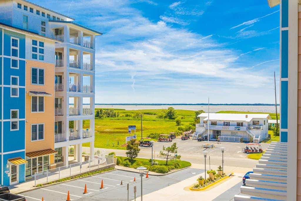 Contemporary 4th-floor ocean & bay-view retreat with outdoor pool, gym, & AC