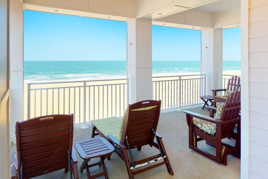 Oceanfront condo with large wraparound deck, expansive views, pools & gym