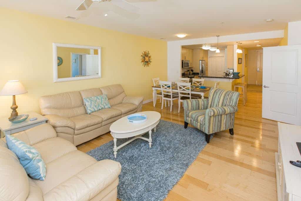 Bright 3rd-floor courtyard condo with balcony, pools, gym, & AC